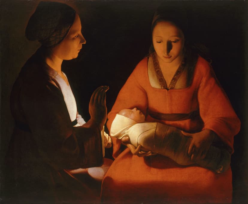 Two women in candlelight watch over a swaddled newborn.